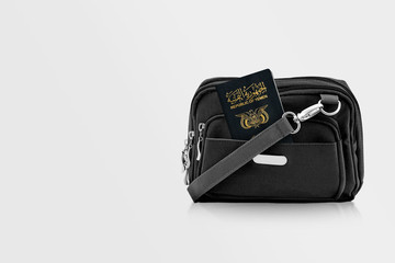Yemen Passport in Black Travel Bag Pocket with Copy Space on Isolated Background