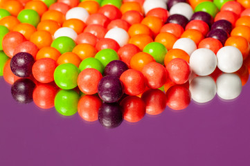Fototapeta na wymiar Colorful bubble gum spilling. Macro with shallow dof. Selective focus.