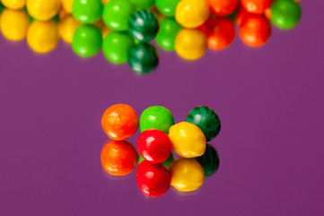 Colorful bubble gum spilling. Macro with shallow dof. Selective focus.