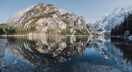 Obraz premium The unesco world heritage Dolomites in Italy lake named Lago de braise, Italy. Beautiful landscape of snowy mountains. Panorama shot. 