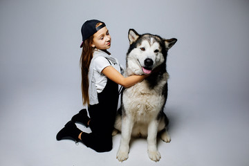 girl hugs a dog