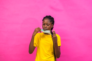 young black lady wearing a nose mask to prevent her from a pandemic