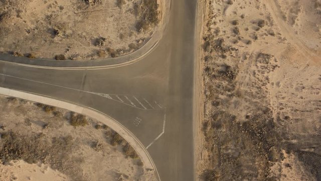 Blowing sand on an African desert road aerial