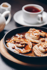 pancakes with peanuts and caramel sauce