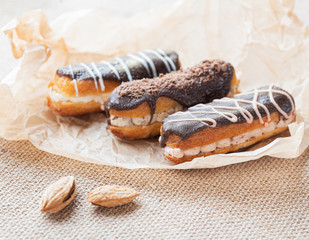 three eclairs on craft paper