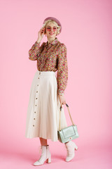 Full-length studio fashion portrait of young elegant happy smiling woman wearing trendy spring...
