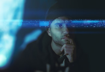 portrait young man is thinking and overlaying numbers and lights. concept Artificial intelligence futuristic hologram. The concept of modern life, technology, iris scanner and internet of things