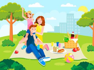 Joyful family on a picnic. Rest with food in park.