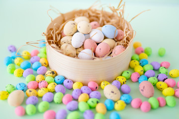 Multicolored eggs and nest on Easter Day