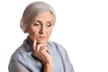 Sad senior woman posing isolated on white background