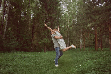 couple hugging in the forest