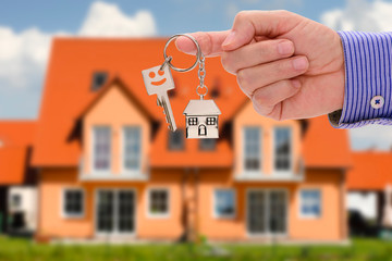 Real estate agent presents a newly built house for purchase