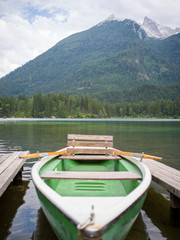 Moutain, lake and boat in Hintersee during summer 