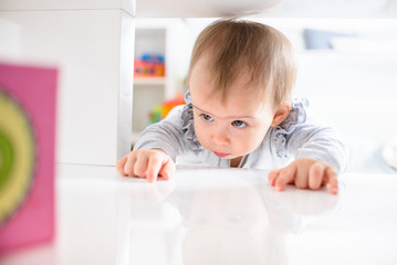 Sweet baby squeezing herself into tight space to get what she want.