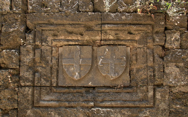 Coats of arms carved on the wall of the fortress of Rhodes, Greece
