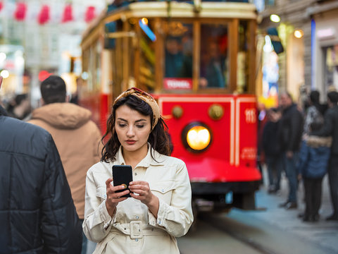 Portrait of beautiful woman while using cell phone