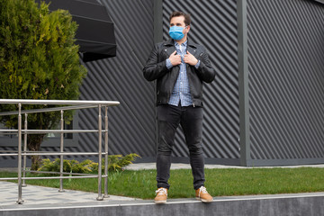 Mature man wearing a protective mask, walking in the city