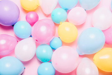 Fototapeta na wymiar Birthday background with colorful balloons, top view