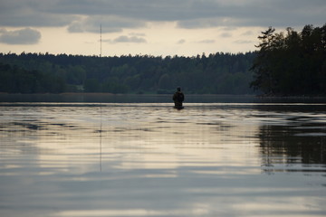 Fisherman in water