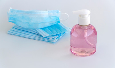 Coronavirus prevention surgical masks and sanitizer gel for hand hygiene spread protection.