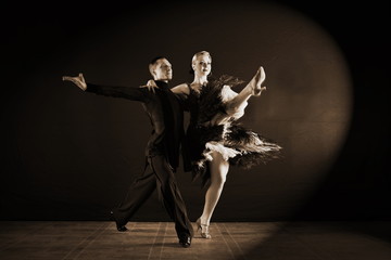 dancers in ballroom isolated on black background