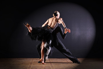 Dancers in ballroom isolated on black background