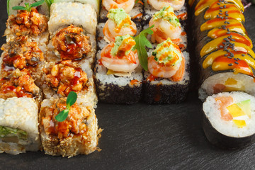 Japanese food: Set of salmon sushi and rolls with salmon and eel