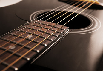 black acoustic guitar close up
