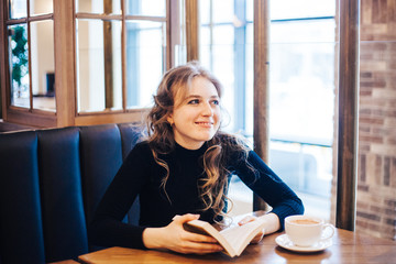 The girl in the cafe, a student or a Manager, meeting with friends in cafes, coffee, and coffee break