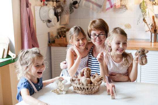 Happy Family At Home. Kids Playing In Puppet Show. Mother And Children Together Have Fun And Game With Toys. Leisure Without Gadgets. Lifestyle Authentic Moment. Social Distancing, Self Isolation.