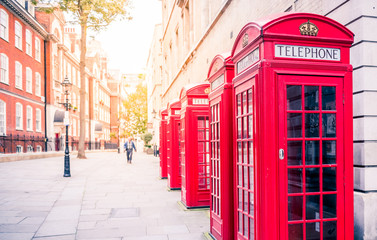 Fototapeta na wymiar Traditional telephone boxes in London, UK