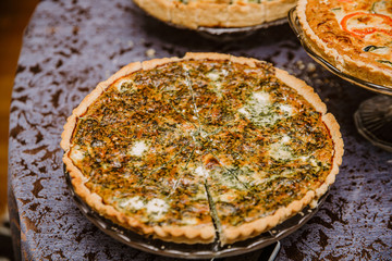 Detail of tart full of tomato, cucumber and cheese served on a party or celebration