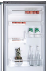 Open fridge full of fresh fruits and vegetables