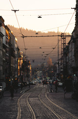 old tram on street sunset