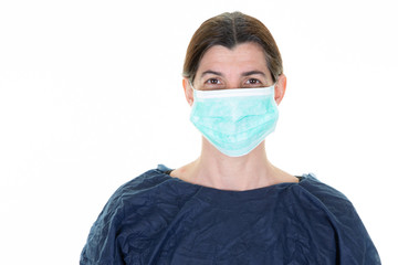 woman nurse medical doctor in blue protective clothing and face mask against covid-19 coronavirus epidemic