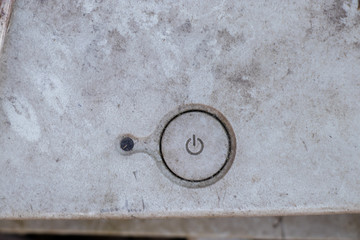 old dirty button on and off on computer close-up