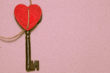 Red heart, key and empty paper, free space