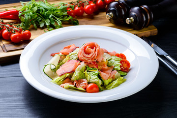 fresh salad of vegetables and salmon