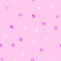 Seamless pattern with pink and white little rings on a pink background