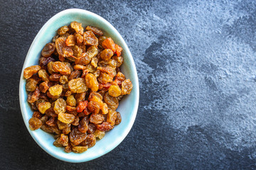 raisins, delicious dried grapes (fresh fruit vitamins) menu concept background. top view. copy space for text keto or paleo diet