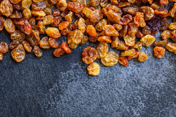 raisins, delicious dried grapes (fresh fruit vitamins) menu concept background. top view. copy space for text keto or paleo diet