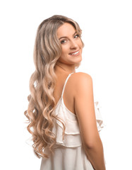 Obraz premium Beautiful young woman with curly hair on white background