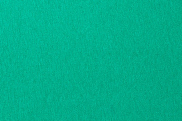 The background is green. Knitted fabric texture.