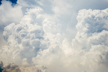 Naklejka na ściany i meble Incredibly wonderful lush cumulus clouds against a blue sky - Image