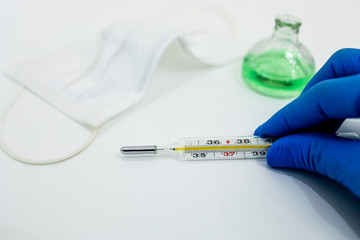  medical mask thermometer on a white background