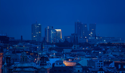 A distant view of the towers of Prague's business district at blue hour. 