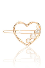 Subject shot of a heart-shaped hair clip made of a curved golden wire and decorated with pearls and a crystal. The fancy hair accessory is isolated on the white backdrop. 