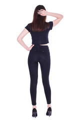 Fototapeta premium Back view portrait young beautiful brunette woman in black jeans