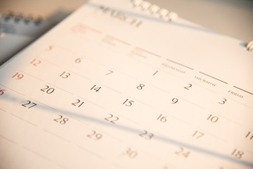 Blurred old calendar in dark tone.