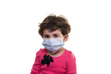 Young girl wearing a protective medical facial mask isolated on a white background.